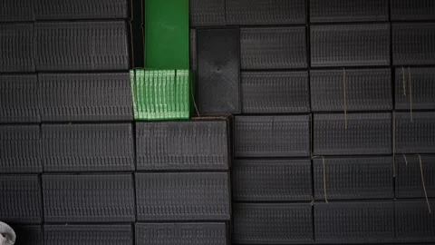 View of stacked black plastic crates in a warehouse, Bangladesh. Vídeos de archivo 335602579