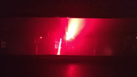 A view on the stage of an underground techno club with rays of red light 스톡 동영상 88209026