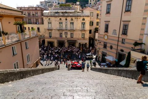 View from staircase onto crowded Amalfi square Фото