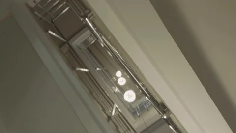 View of the stairs from the bottom to the top of many floors with silver iron ra Stock Footage 123585804