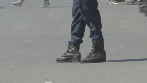 View of a standing man from his knee wearing a leather boot Stock Footage 108847241