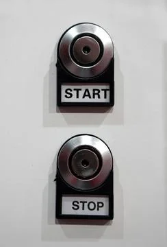 View of Start and Stop switch knob on a control panel in an industry Stock-Fotos