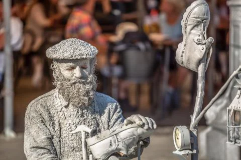 View of statue man, doing shoemaker acting on the street, Porto city, Portuga Stock Photos