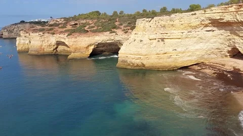 View on the steep cliffs of the Algarve coast in Portugal on Praia da Mesquita Stock Footage 218363973