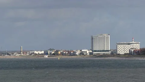 View from the steep coast to the baltic sea, beach of Rostock and architecture Stock Footage 143593300