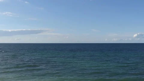 View from the steep coast to ocean - blue sky with some clouds Stock-Footage 139152714