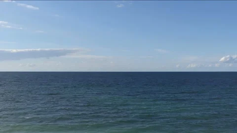 View from the steep coast to ocean - blue sky with some clouds Stock Footage 139250755