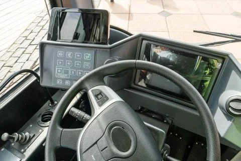 View of the steering wheel and dashboard of a new modern bus. Urban public tr Stock-Fotos