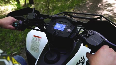 View of the steering wheel of the ATV while driving. Stock Footage 139884545