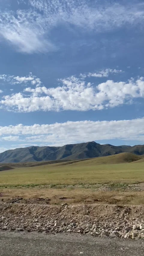 View of the steppe and mountains from the car Stock Footage 251993865
