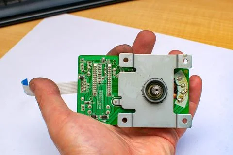 View of a stepper motor with an electrical diagram of an engine driver Stock Photos