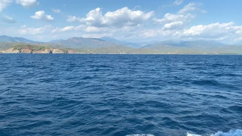 View from the stern of the ship on open sea with many islands Stock Footage 122437387