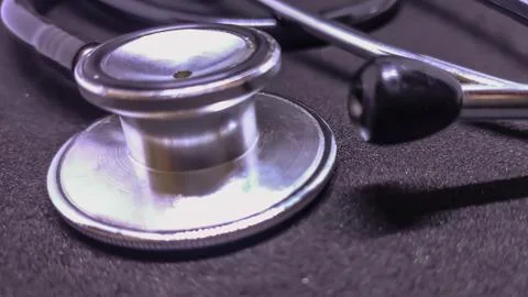 View of stethoscope in black background. Close up. Stock Photos