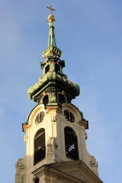 View of the Stiftskirsche tower with the clock Stock Photos