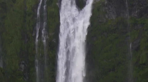 View of Stirling Falls and ferry boat below waterfall, South Island, New Zealand Stock Footage 51480911