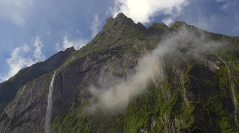View of Stirling Falls flowing from mountain top at Milford Sound, South Island, Stock Footage 51480901