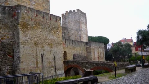 View of the stone archway and walls of a historic castle. Stock Footage 327685329
