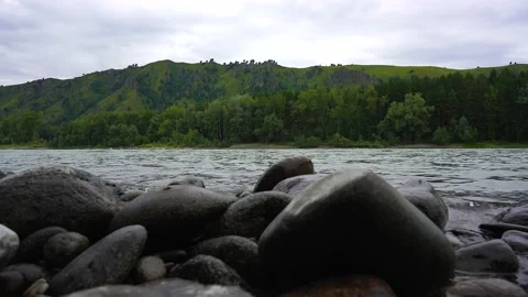 View from the stone bank to the mountain river Stock Footage 204563663