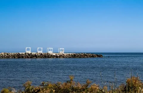 View of the stone beach of the Thin Cape and a small Bay of huge boulders 스톡 사진