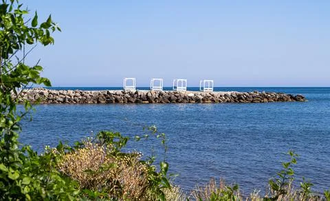 View of the stone beach of the Thin Cape and a small Bay of huge boulders 스톡 사진