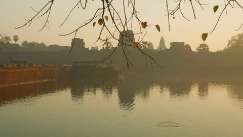 View of stone bridge leading to Angkor Wat temple early in morning. It's closed Stock Footage 88285044