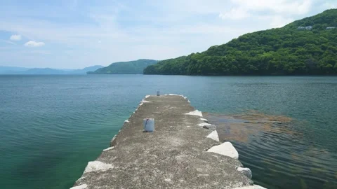 View of stone jetty at the beach in Izu Peninsula, Shizuoka, Japan Stock Footage 312377507