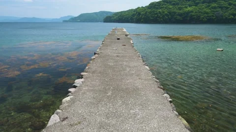 View of stone jetty at the beach in Izu Peninsula, Shizuoka, Japan Stock Footage 312377516