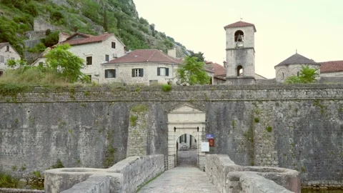 View of the stone surrounding wall and the entrance arch to the old town Stock Footage 281846374