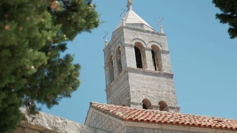View of stone tower in summer among fluffy foliage. Video stock 82239745