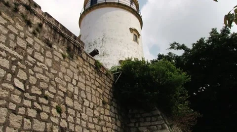View to the stone wall and lighthouse of the Guia fortress in Macau, China. Stock Footage 60813706
