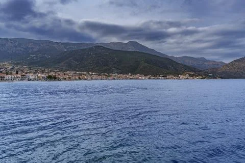View of storm clouds over the sea and mountains Stock Photos
