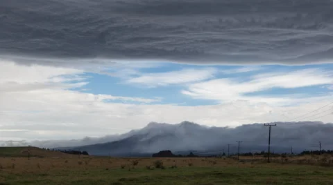 View of storm over mountain and landscape Stock Footage 66001916