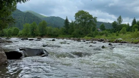 View of a stormy mountain river flowing down from the mountains Stock Footage 249901719