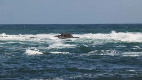 View of stormy ocean and rocks in water Stock Footage 310841920