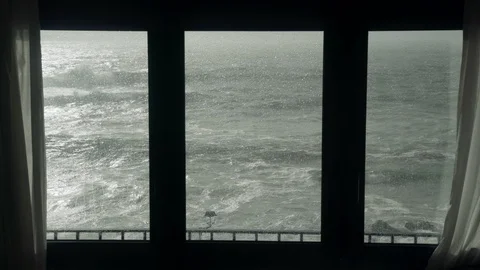 View of the stormy sea from the window. Watching the storm. Severe raging sea Stock-Footage 124485613