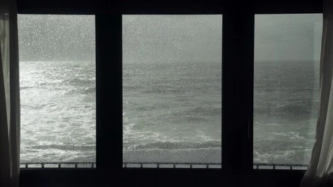 View of the stormy sea from the window. Watching the storm. Severe raging sea Stock-Footage 124485832
