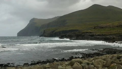 View of stormy surf from the village of Eiði in the Faroe Islands. Видео 154552225
