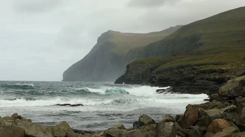 View of stormy surf from the village of Eiði in the Faroe Islands. Video stock 154552273