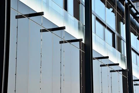 A view at a straight facade of a modern building Stock Photos