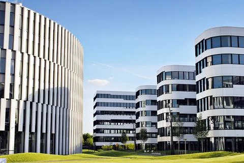A view at a straight facade of a modern building Stock Photos