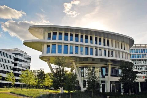 A view at a straight facade of a modern building Stock Photos