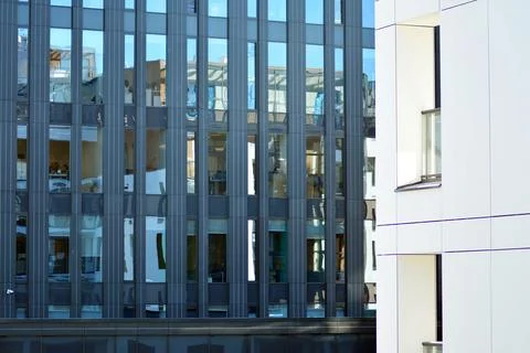 A view at a straight facade of a modern building Stock Photos