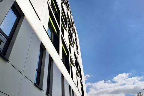 A view at a straight facade of a modern building Stock Photos