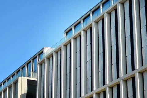 A view at a straight facade of a modern building Stock Photos