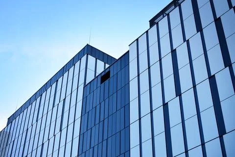 A view at a straight facade of a modern building Stock Photos