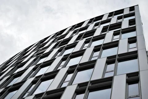 A view at a straight facade of a modern building Stock Photos