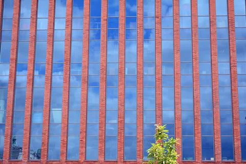 A view at a straight facade of a modern building Stock Photos