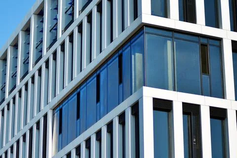 A view at a straight facade of a modern building Stock Photos
