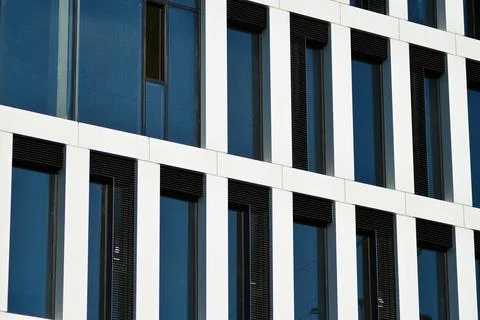 A view at a straight facade of a modern building Stock Photos