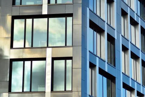 A view at a straight facade of a modern building Stock Photos